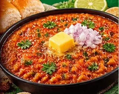Pav bhaji topped with butter and onion